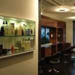 Barbershop with cabinet full of product.