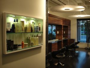 Barbershop with cabinet full of product.